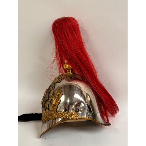 43 - A Household Cavalry Royal Horse Guards Officer's helmet, with red plume, applied brass laurel wreath... 