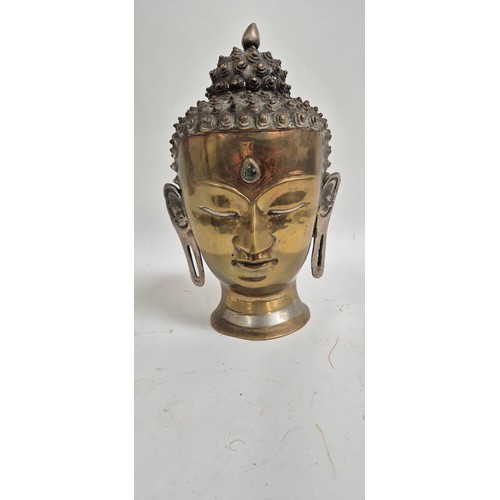 444 - A Tibetan bronze Buddha head, 30cm