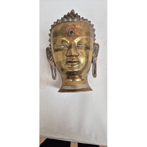 444 - A Tibetan bronze Buddha head, 30cm