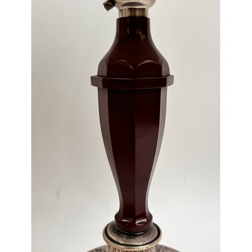 18 - A 1930s Art Deco table lamp in Bakelite, having a sterling silver base with martele finish, marked f... 