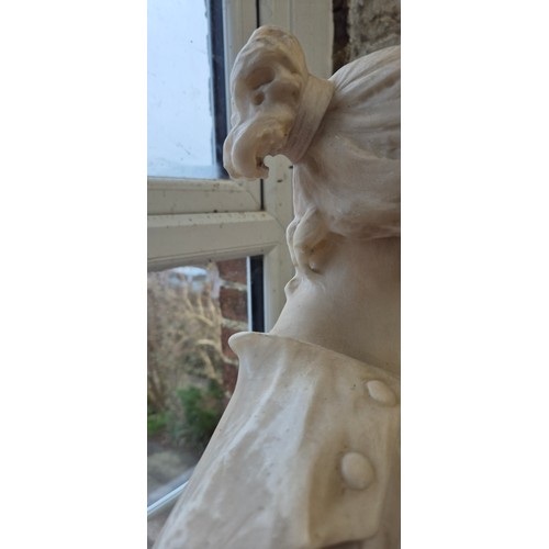 21 - A large carved white alabaster figure of a young lady with flowers, H91cm, together with a speckled ... 