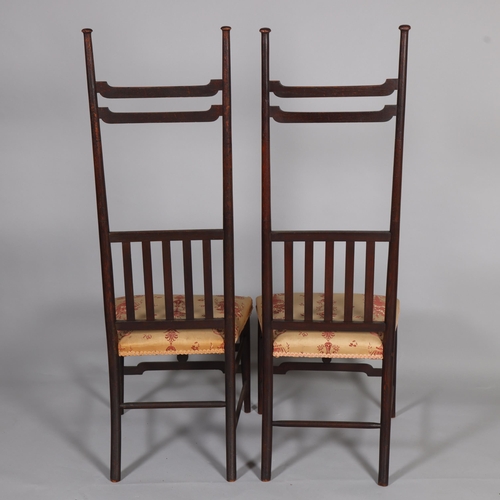 35 - A pair of late Victorian Aesthetic or Arts and Crafts high-back chairs, in the manner of EW Godwin, ... 