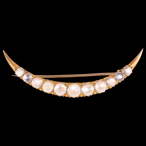 1221 - An Antique Victorian 18ct gold moonstone crescent brooch, circa 1890, claw set with row of graduated... 