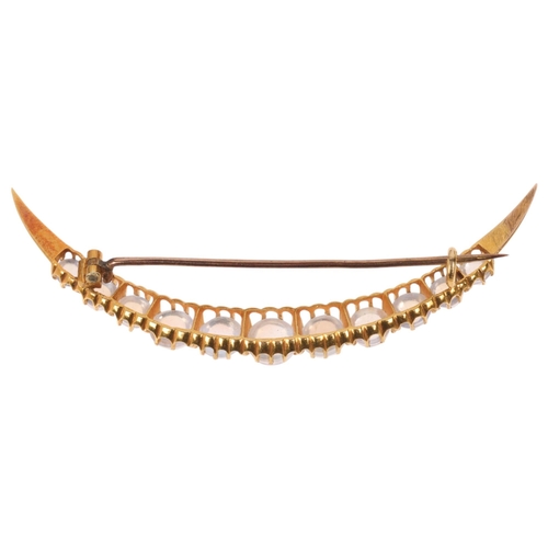 1221 - An Antique Victorian 18ct gold moonstone crescent brooch, circa 1890, claw set with row of graduated... 