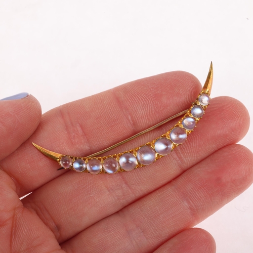 1221 - An Antique Victorian 18ct gold moonstone crescent brooch, circa 1890, claw set with row of graduated... 