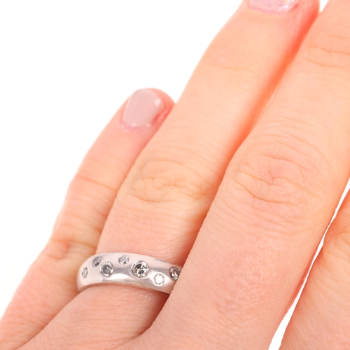 1309 - An 18ct white gold diamond band ring, maker CPM, set with modern round brilliant-cut diamonds, total... 