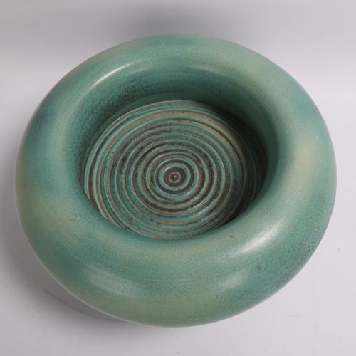 192 - A studio ceramic stoneware pillow bowl on 5 turned legs, blue/green soda glaze,  no makers marks, di... 