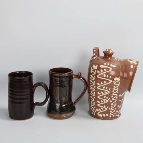 196 - A large slipware salt pig, and 2 other studio pottery tenmoku glazed tankards, tankards with maker's... 