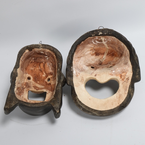 197 - A pair of mid-20th century plaster wall masks, longest 27cm, and another Indian style papier-mache d... 