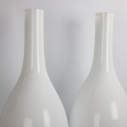 24 - A pair of large, floor-standing, white lined glass vases, height 71cm