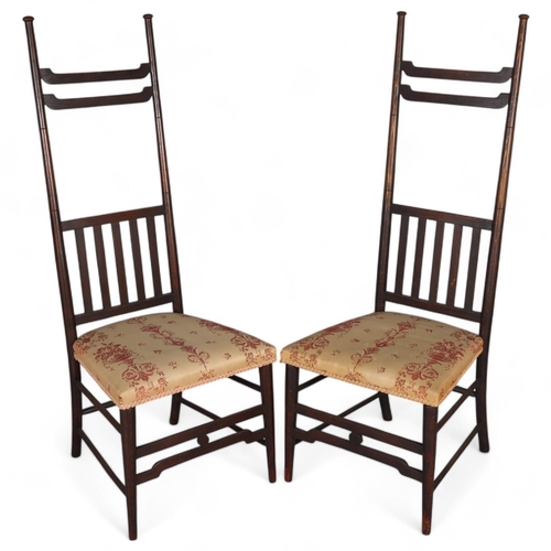 35 - A pair of late Victorian Aesthetic or Arts and Crafts high-back chairs, in the manner of EW Godwin, ... 