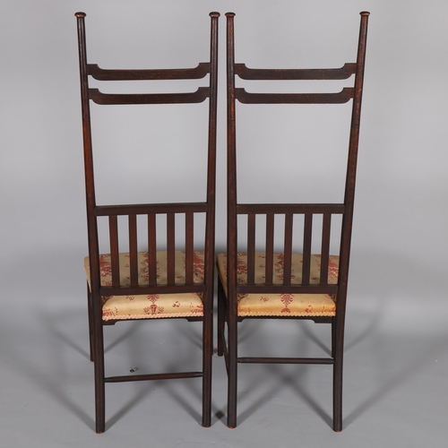 35 - A pair of late Victorian Aesthetic or Arts and Crafts high-back chairs, in the manner of EW Godwin, ... 