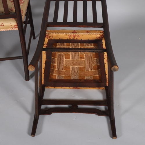 35 - A pair of late Victorian Aesthetic or Arts and Crafts high-back chairs, in the manner of EW Godwin, ... 