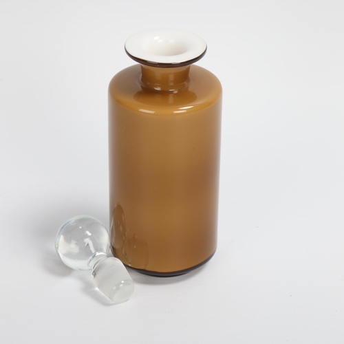 54 - MICHAEL BANG, DANISH, for Kastrup Holmegaard, a small Umbra cased glass jar with stopper, original l... 