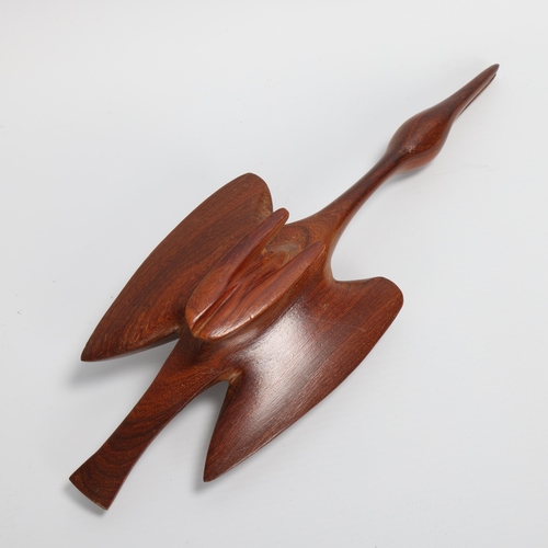 56 - A mid-20th century teak wood carving of swan in flight, length 28cm