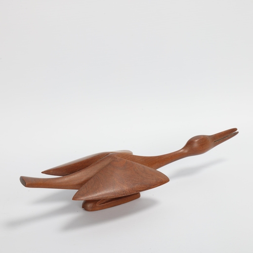 56 - A mid-20th century teak wood carving of swan in flight, length 28cm