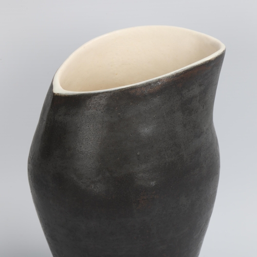 68 - DEANA MOORE, British, a hand-coiled vessel with burnished black exterior and white internal glaze, m... 