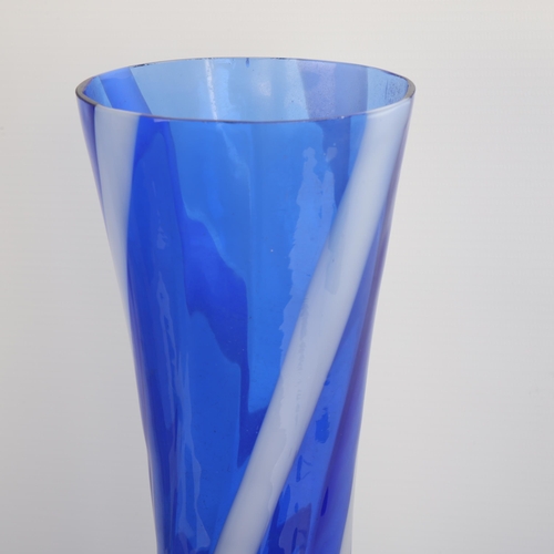 76 - A mid-20th century large blue and white swirl glass vase, partial label to base, height 50cm