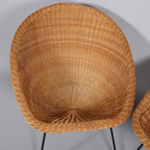 77 - A pair of mid-century wicker saucer chairs on iron legs, height 74cm