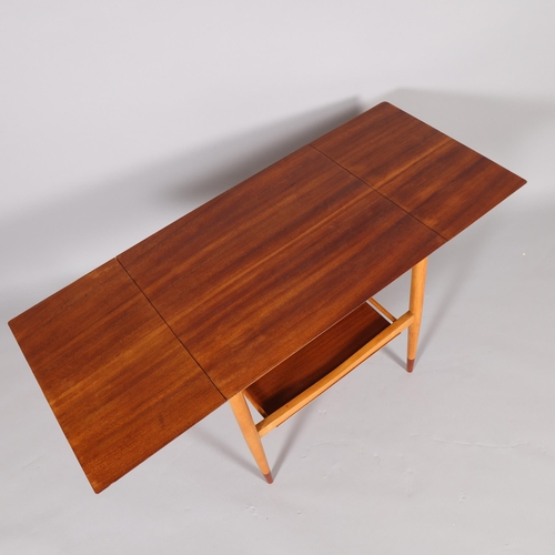 79 - A mid-20th century 2-tier side table with folding leaves in the style of BORGE MOGENSEN, plywood top... 