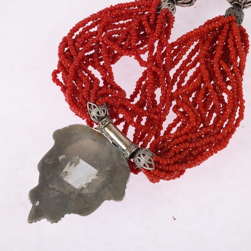 1491 - A Tibetan multi-strand coral bead necklace, with white metal coral pendant, pendant 59.5mm, necklace... 