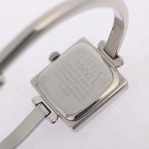 1015 - GUCCI - a lady's stainless steel 1900L quartz bangle watch, circa 2000, square silvered dial with le... 