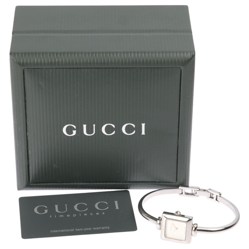 1015 - GUCCI - a lady's stainless steel 1900L quartz bangle watch, circa 2000, square silvered dial with le... 