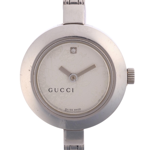 1023 - GUCCI - a lady's stainless steel 105 Series quartz bangle watch, silvered floral dial with diamond h... 