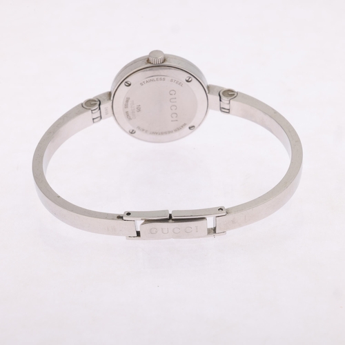 1023 - GUCCI - a lady's stainless steel 105 Series quartz bangle watch, silvered floral dial with diamond h... 