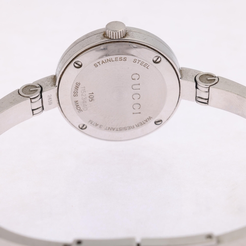 1023 - GUCCI - a lady's stainless steel 105 Series quartz bangle watch, silvered floral dial with diamond h... 