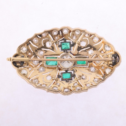 1104 - An Art Deco emerald and diamond plaque brooch, circa 1920, of shaped oval pierced form, centrally mi... 