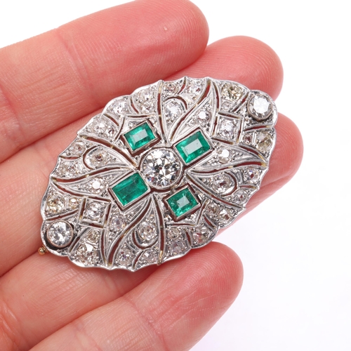 1104 - An Art Deco emerald and diamond plaque brooch, circa 1920, of shaped oval pierced form, centrally mi... 