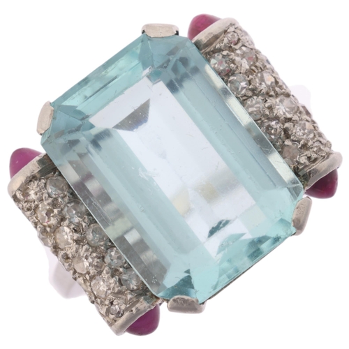 1108 - An aquamarine ruby and diamond cocktail ring, circa 1940, centrally set with a 9.20ct octagonal step... 