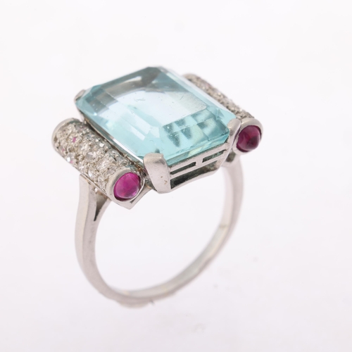 1108 - An aquamarine ruby and diamond cocktail ring, circa 1940, centrally set with a 9.20ct octagonal step... 