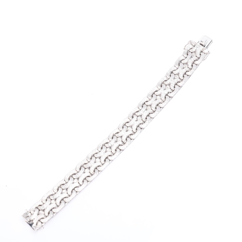 1118 - A heavy 18ct white gold interwoven link chain bracelet, maker TW, import hallmarks London 1972, text... 