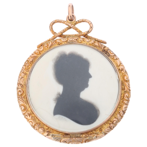 1124 - A Georgian silhouette locket pendant, by John Miers (1758 - 1821), the circular hand painted panel d... 