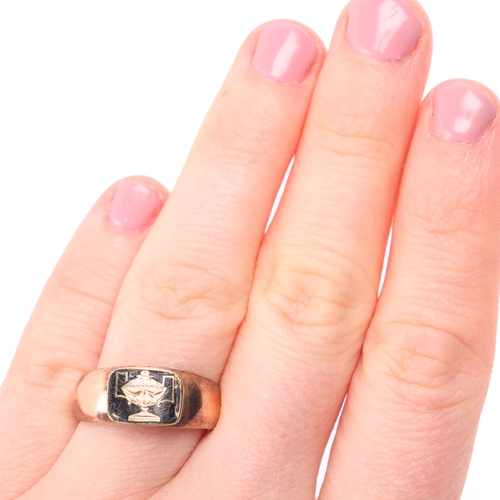 1128 - A Georgian 9ct rose gold enamel 'Urn' mourning ring, the oval enamel panel depicting funerary urn, o... 