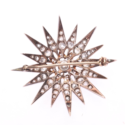 1130 - An Antique Victorian diamond star brooch, the central cut-down collet set old mine-cut diamond weigh... 