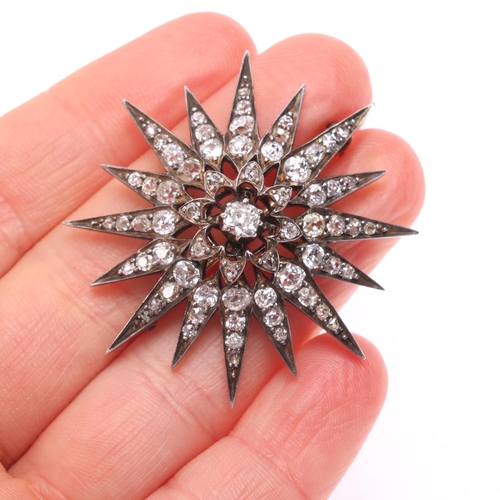 1130 - An Antique Victorian diamond star brooch, the central cut-down collet set old mine-cut diamond weigh... 