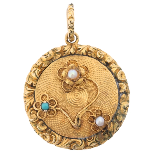 1132 - An Antique Victorian turquoise and pearl mourning locket pendant, of circular form, with engine turn... 