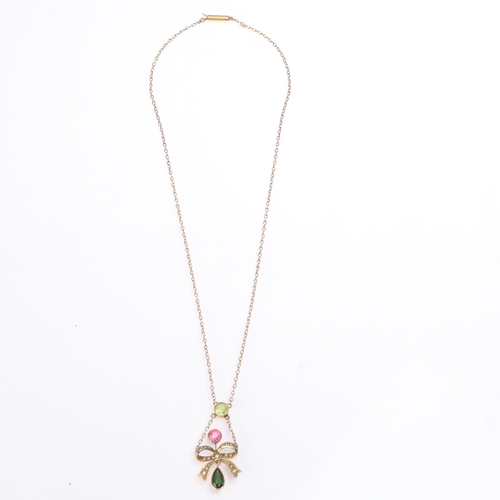 1136 - An Antique Edwardian 9ct gold gem set ribbon bow lavaliere pendant necklace, circa 1910, the ribbon ... 