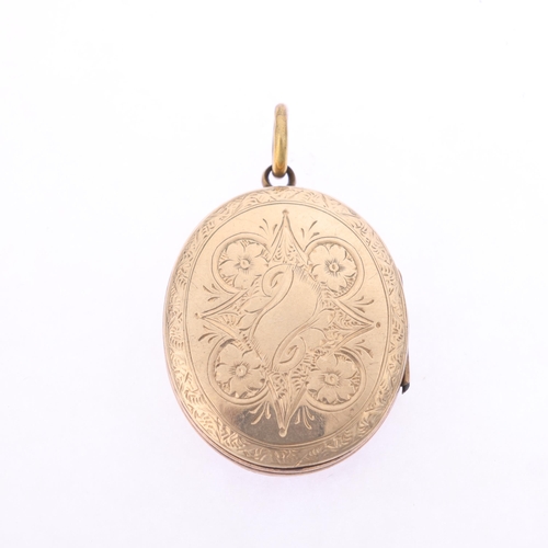 1142 - An Antique Victorian enamel photo locket pendant, oval form with allover chased floral decoration, u... 