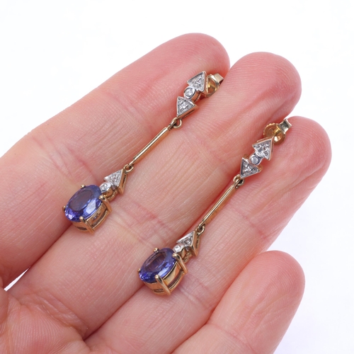 1143 - A pair of 9ct gold tanzanite and cubic zirconia drop stud earrings, claw set with oval mixed-cut tan... 