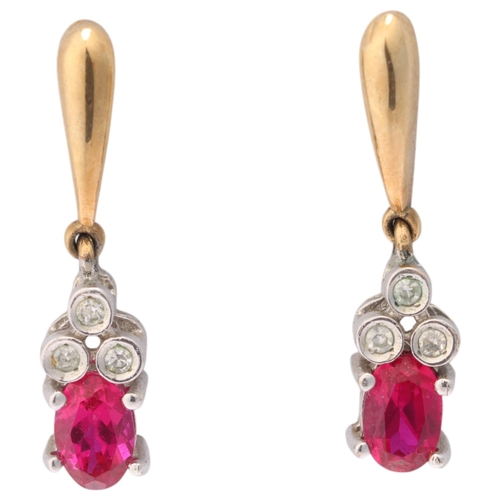 1145 - A pair of 9ct gold ruby and diamond drop stud earrings, set with oval mixed-cut rubies and single-cu... 