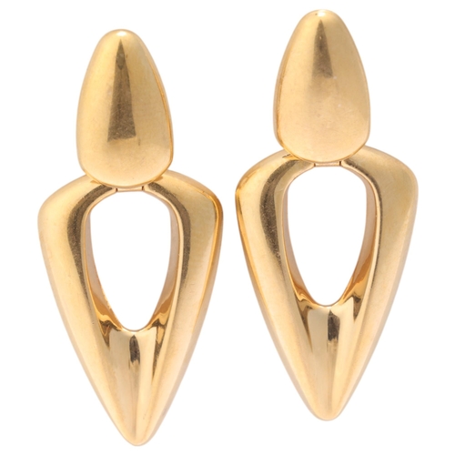 1152 - A pair of Italian modernist 9ct gold drop stud earrings, by Unoaerre, openwork Delta wing form, with... 