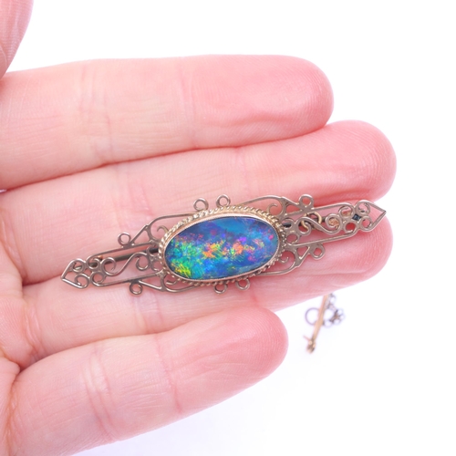 1156 - A Vintage 9ct gold black opal doublet brooch, openwork form, unmarked mount tests as 9ct, 52.5mm, 4g