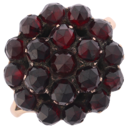 1168 - An Antique Victorian Bohemian garnet cluster ring, set with rose-cut garnets with closed-back settin... 