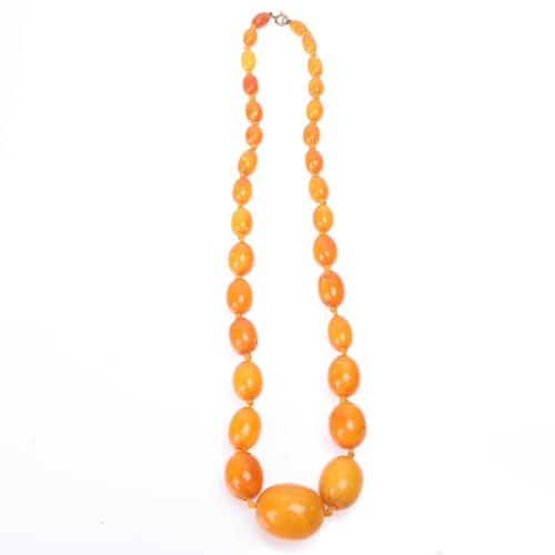 1170 - A Vintage single-strand graduated butterscotch amber bead necklace, beads ranging from: 27.1mm - 11.... 