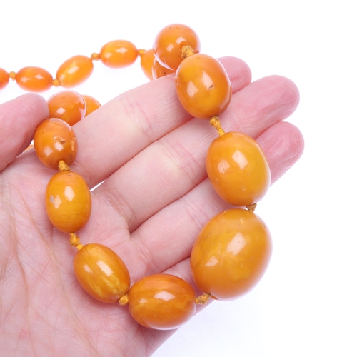 1170 - A Vintage single-strand graduated butterscotch amber bead necklace, beads ranging from: 27.1mm - 11.... 