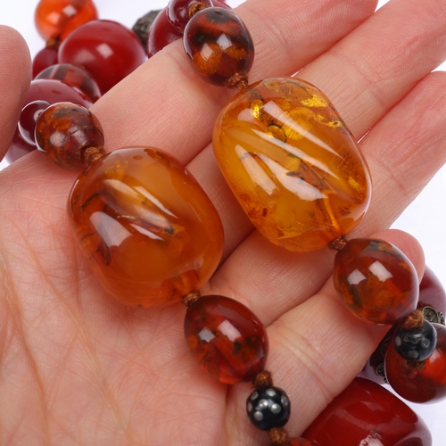 1174 - A Vintage single-strand graduated amber bead necklace, including cherry and butterscotch amber beads... 